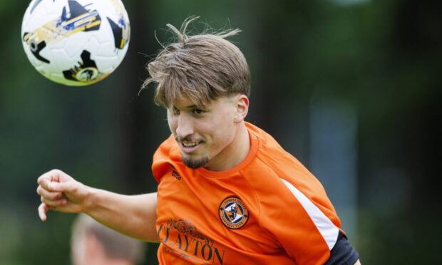 Straight into the action: Dundee United's Dario Naamo