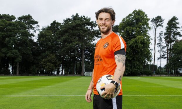 Will Ferry poses for snaps at United's St Andrew's training centre