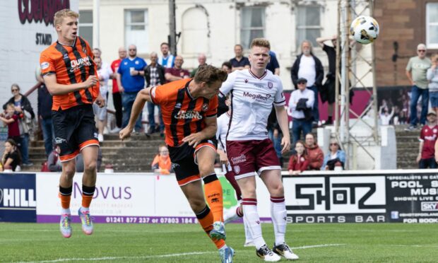 Bert Esselink heads home the opener.
