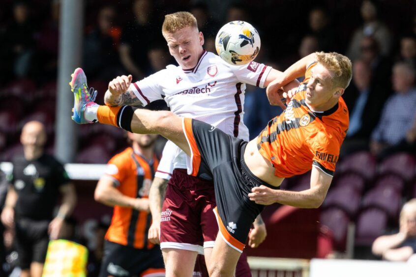 Dundee United's sole attacking capture to date, Zac Sapsford, in the thick of the action