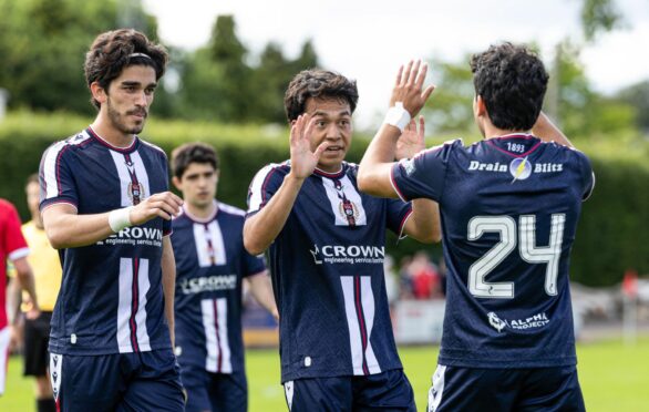 Dundee trialist Jose Urias (R) celebrates with Victor Lopez (C) and Jorge Landeros (L) after scoring to make it 3-0 at Brechin. Image: Ross Parker/SNS