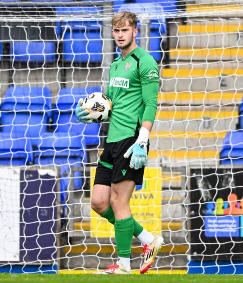 Toby Steward clutches the ball.