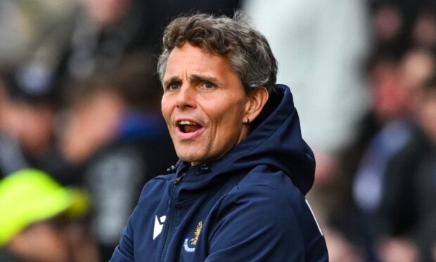 St Johnstone boss Simo Valakari with his arms folded on the touchline.