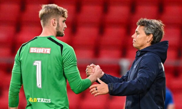 Toby Steward shakes hands with Simo Valakari at the end of the Falkirk game.