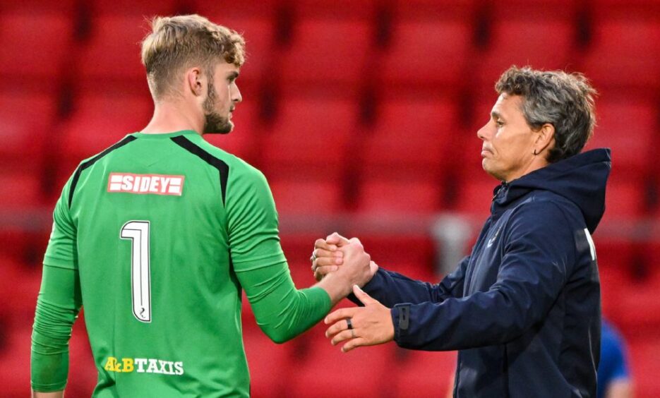 Toby Steward shakes hands with Simo Valakari at the end of the Falkirk game.