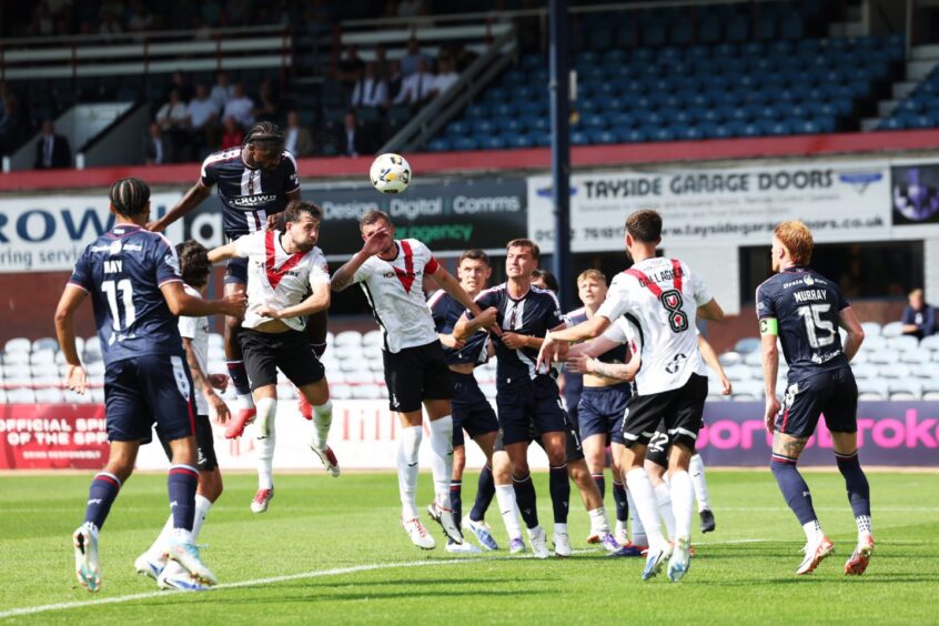 Billy Koumetio sees one of two headers cleared off the line by Rhys McCabe. Image: Roddy Scott/SNS