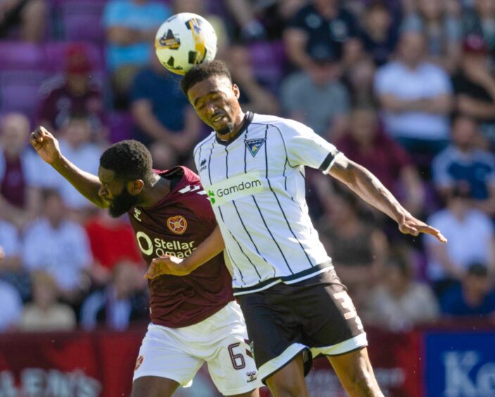 Dunfermline midfielder Tashan Oakley-Boothe jumps to the head the ball against Hearts.