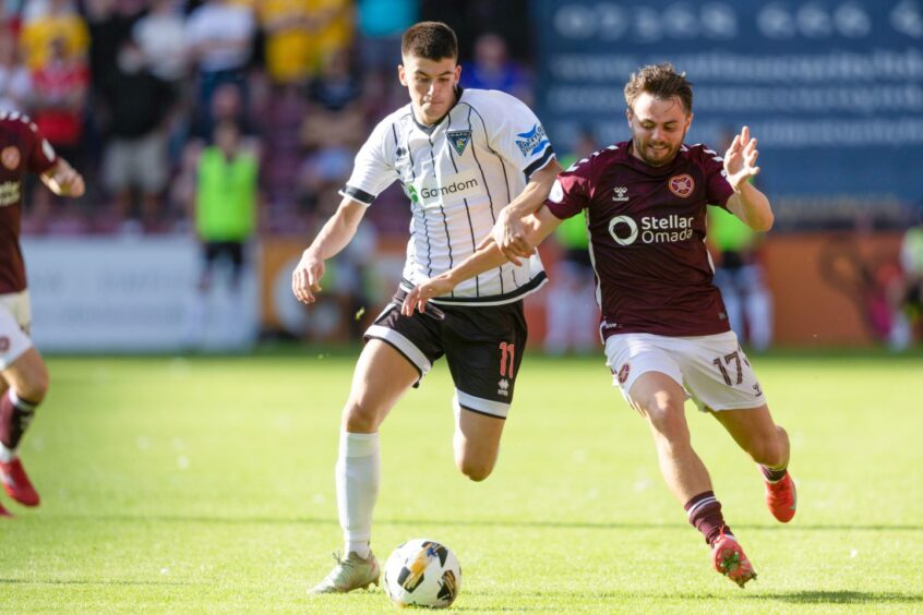 Dunfermline Athletic wing-back Shea Kearney races to beat Hearts winger Alan Forrest to the ball.
