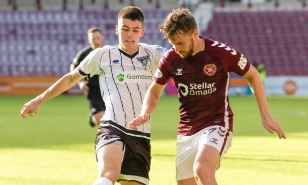 Shea Kearney battles for possession against Hearts.