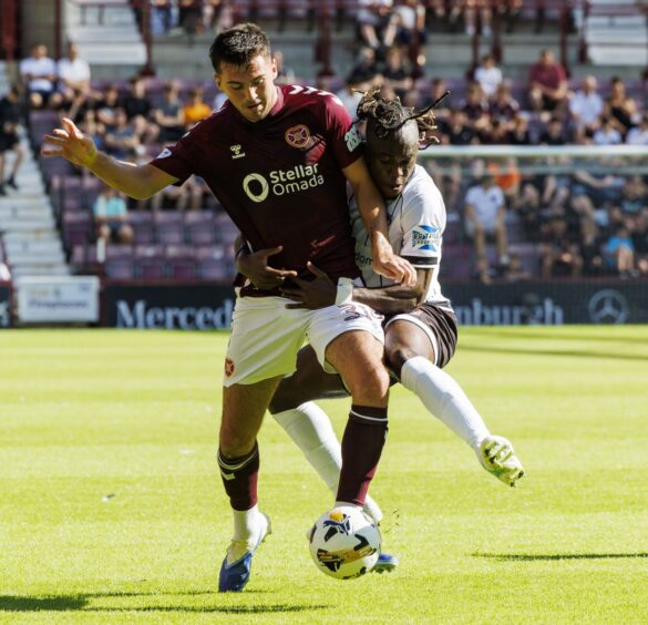 Ewan Otoo challenges Hearts full-back Oisin McEntee during Dunfermline's 4-1 cup defeat at Tynecastle.