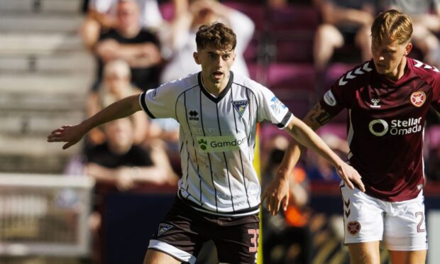 DAFC attacker Josh Cooper gets on the ball for the Pars against Hearts.