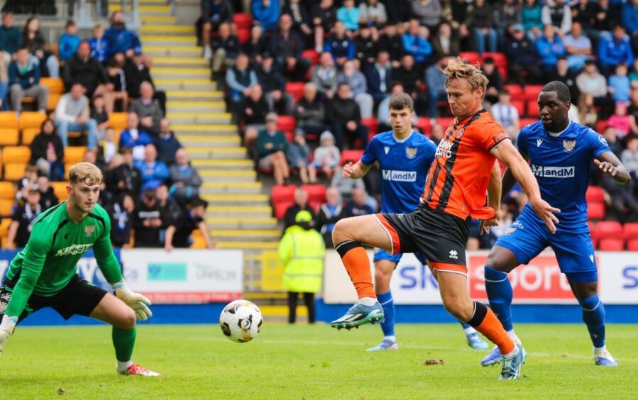 Bert Esselink prods home his second non-competitive goal for United.