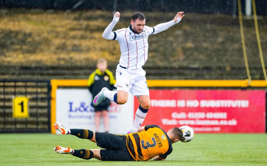 Drey Wright losses possession. Image: Paul Devlin/SNS