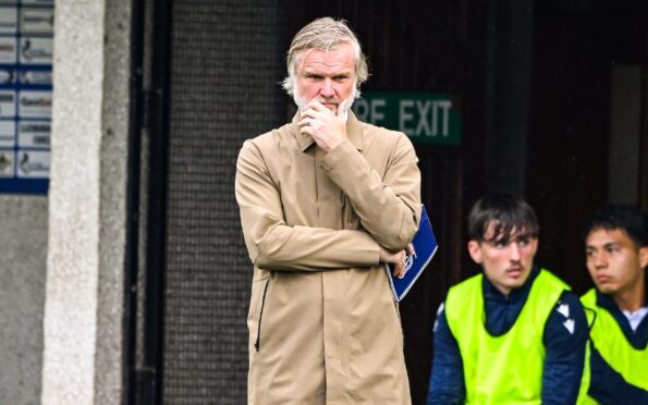 Steven Pressley watches on as Dundee fall to defeat. Image: Paul Devlin/SNS