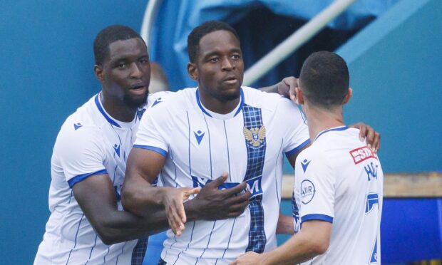Uche Ikpeazu (middle) celebrates with Cheick Diabate (L) and Jason Holt (R) after scoring. Image: Mark Scates / SNS Group