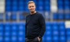 Raith Rovers manager Barry Robson stands with his hands in his pockets.