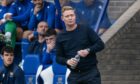Raith Rovers boss Barry Robson on the touchline at McDiarmid Park with a water bottle in his hands.
