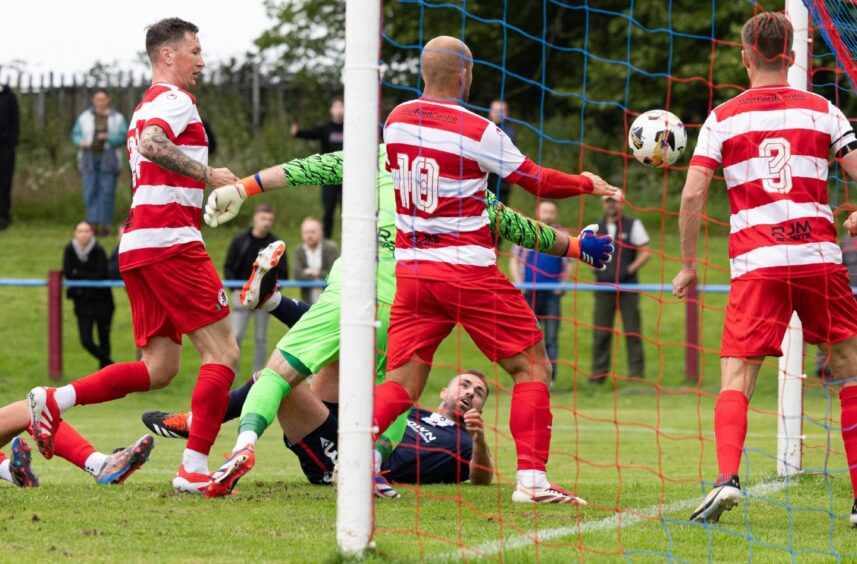 Clark Robertson scrambles the ball in for 1-0. Image: Ross Parker/SNS