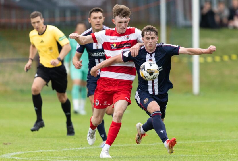 Fin Robertson on the ball for Dundee.