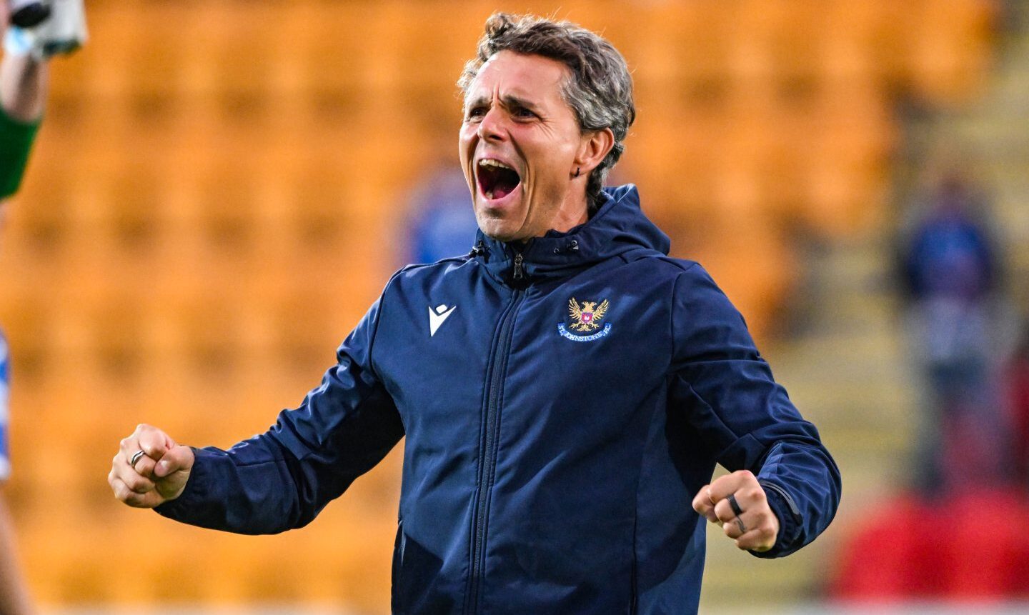 St Johnstone boss Simo Valakari clenches his fists and roars with delight.