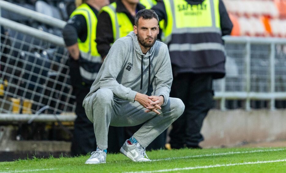 UNA Strassen manager Stefano Bensi on the Tannadice touchline