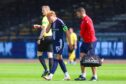 Simon Murray limps off against Montrose. Image: Ross MacDonald/SNS