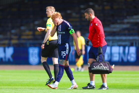 Simon Murray limps off against Montrose. Image: Ross MacDonald/SNS