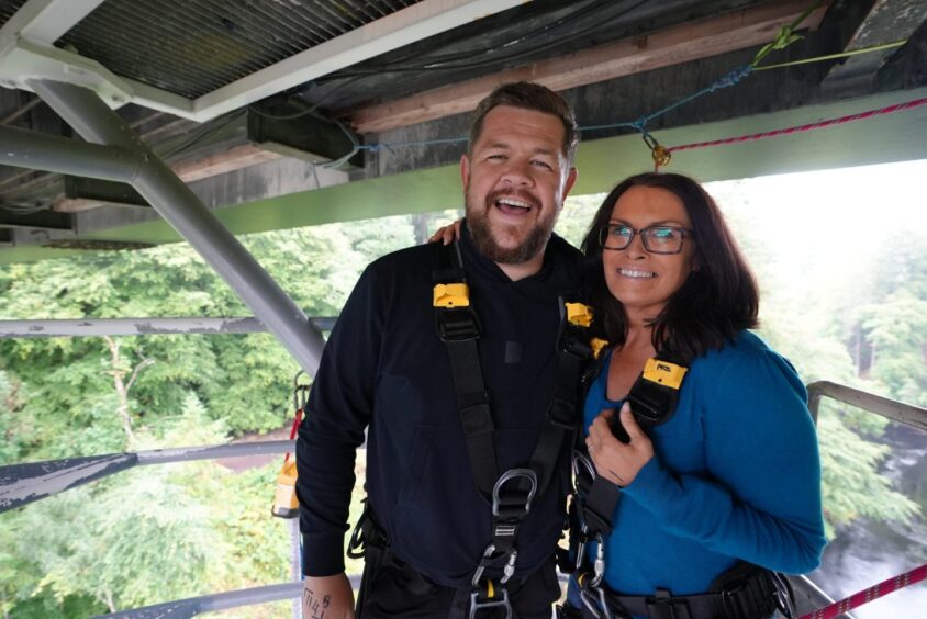 Grado and Judith Ralston in bungee harnesses under bridge at Killiecrankie