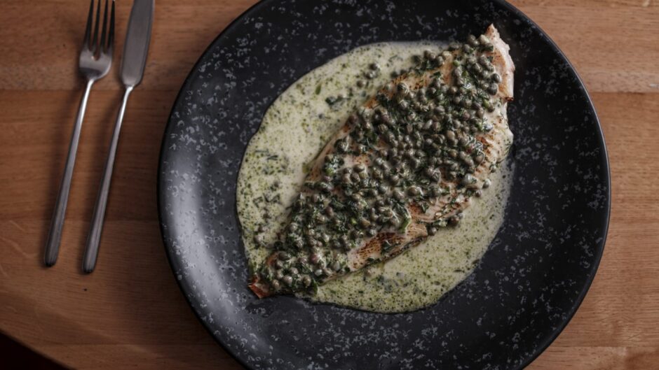 A fish covered in Champagne sauce.