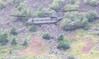 RAF Chinook flying low in Glen Doll.