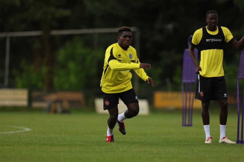 Isaac Pappoe gets stuck into United training at their Doorwerth base.