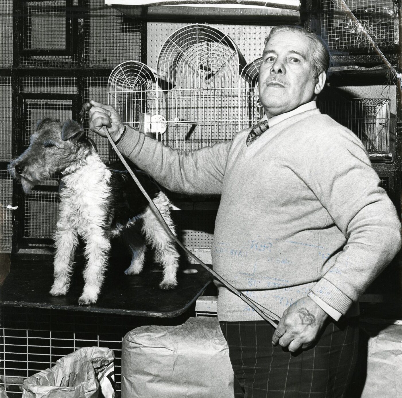 Jockie poses with one of his dogs, a small terrier