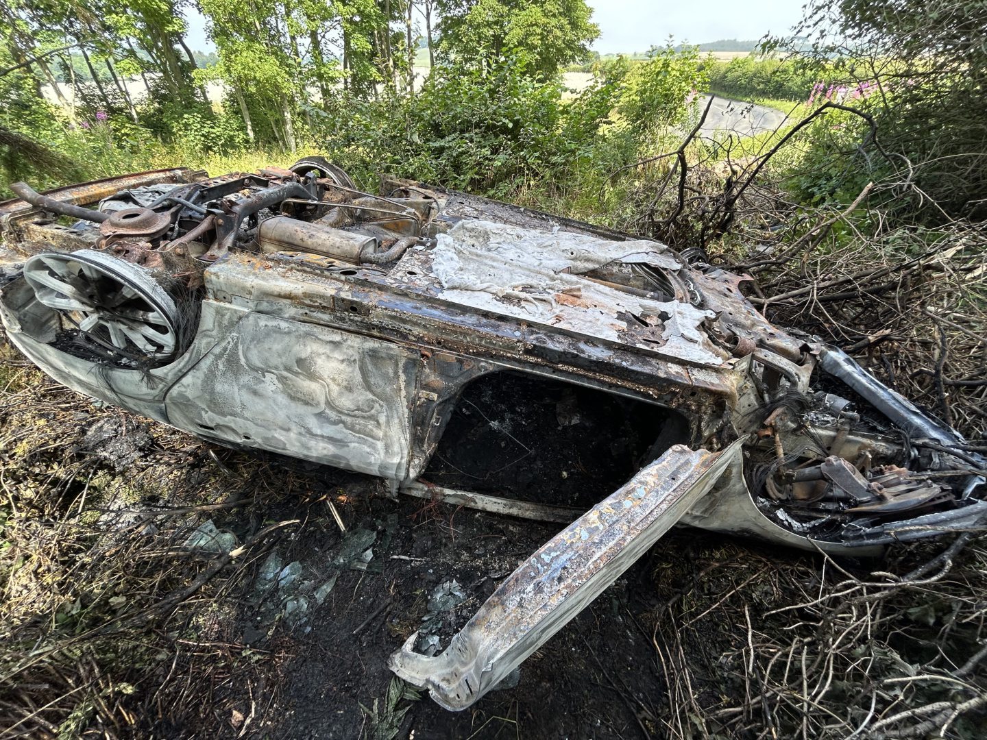 A close up image of the burnt-out car following the B941 crash.