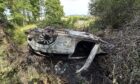 The burnt out wreckage of the car after the B941 crash.