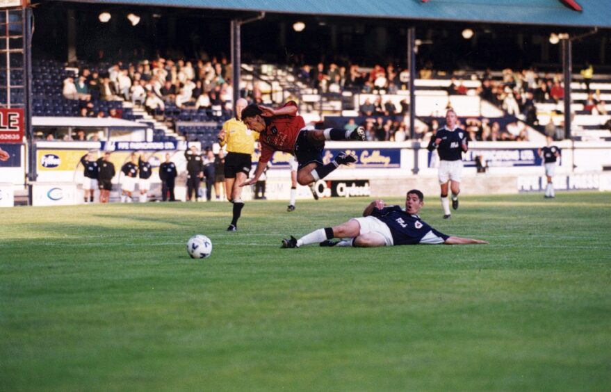 Bonetti jumps over a sliding tackle by a Raith Rovers player at Stark's Park.