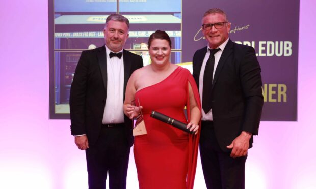 Quality Meat Scotland chief executive Sarah Millar collects the best small butcher in Scotland award on behalf of Puddledub.