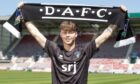 Rory MacLeod holds up a DAFC scarf.