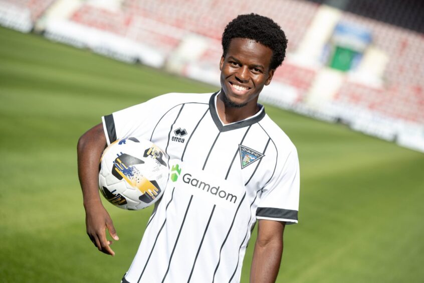 Alfons Amade smiles for the camera in Dunfermline's new home kit.