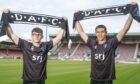 Andrew Tod and brother John hold up DAFC scarves.