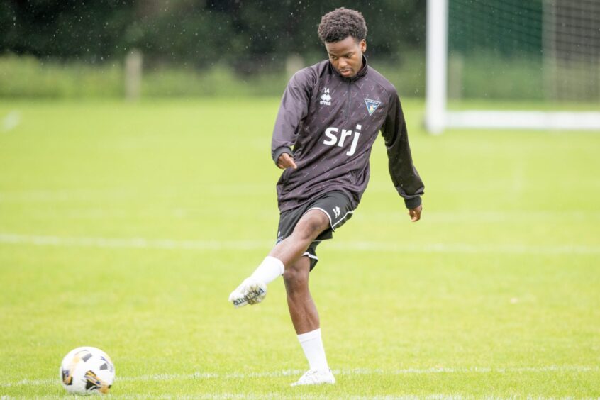 Dunfermline Athletic signing Alfons Amade plays a pass with his left foot in training.