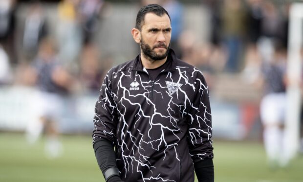 Dunfermline Athletic keeper Deniz Mehmet warms up.