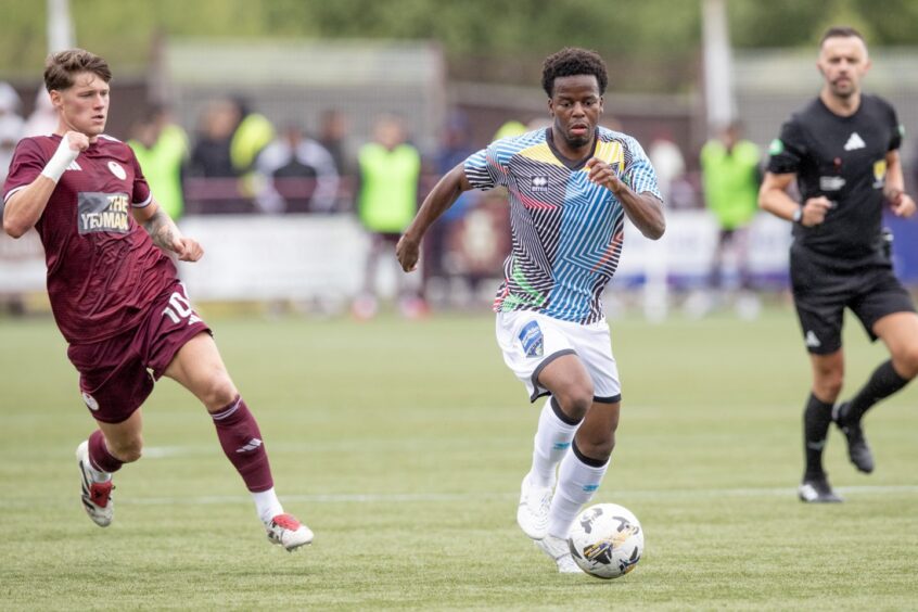 Alfons Amade burst forward with the ball at his feet in DAFC's friendly win over Kelty Hearts.