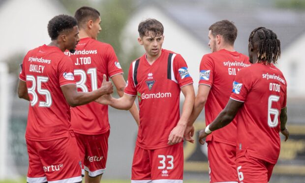 Dunfermline Athletic players congratulate goal-scorer Josh Cooper.