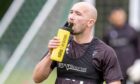 Dunfermline Athletic striker Chris Kane takes a drink.