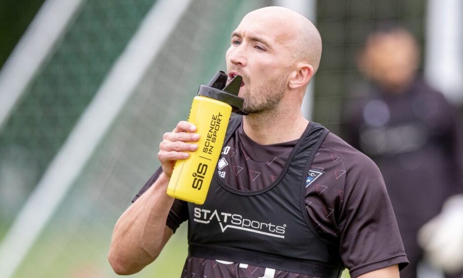 Dunfermline Athletic striker Chris Kane takes a drink.