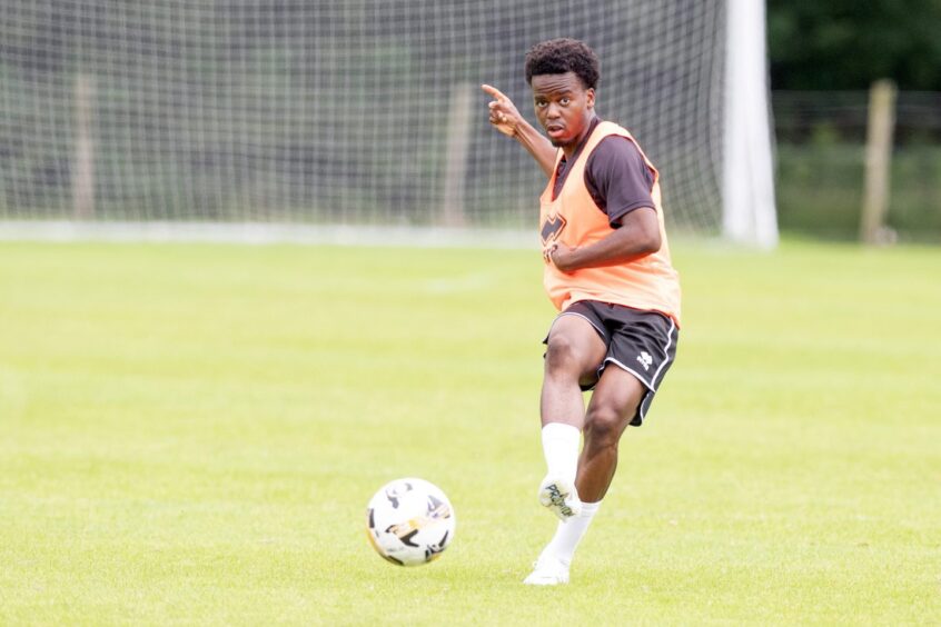 Alfons Amade plays a right-foot pass in Dunfermline training.