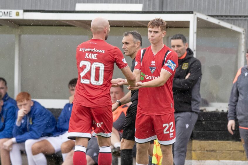 Dunfermline team-mates Chris Kane and Keith Bray shake hands.