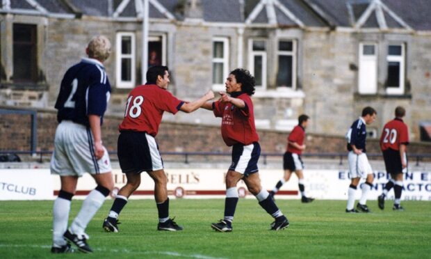 Juan Sara congratulates Fabian Caballero at Stark's Park. Image: DC Thomson.