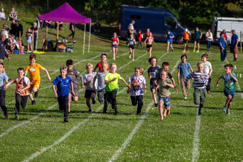 Small boys running a race at Kenmore Highland Games