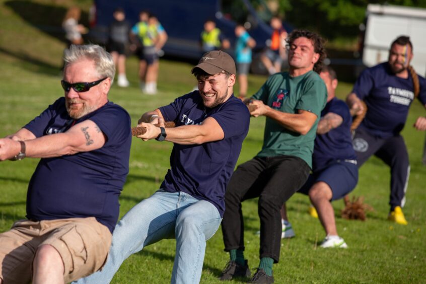 Men doing tug of war